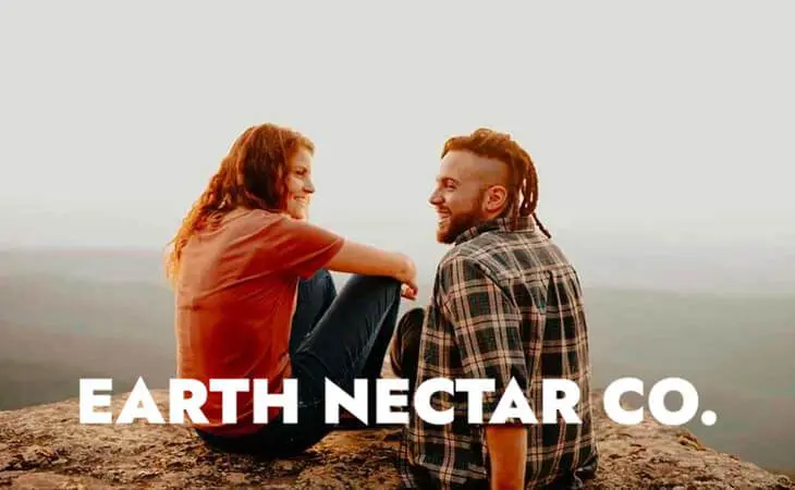 Two friends relaxing outdoors, branded Earth Nectar Co.