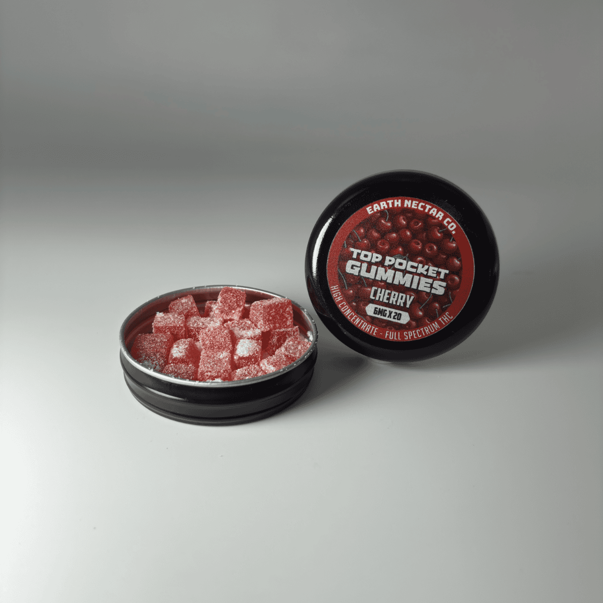Earth Nectar Co. Top Pocket Gummies in Cherry, THC mini gummies in an open pocket tin