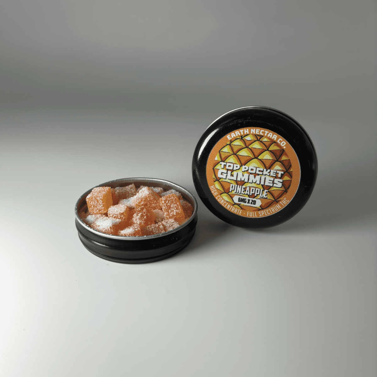 Earth Nectar Co. Top Pocket Gummies in Pineapple, THC mini gummies in an open pocket tin