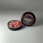 Earth Nectar Co. Top Pocket Gummies in Strawberry, open tin of THC mini gummies beside the sealed tin
